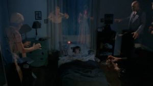 Young girl Cathy (Dana Nardelli) is tormented by spirits in her bedroom in Roberta Findlay's Lurkers (1987)