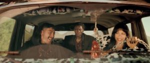 Killer's Romeo (Javier Bardem) and Perdita (Rosie Perez) enjoy a road trip with sidekick Adolfo (Screamin' Jay Hawkins) in Alex de la Iglesia's Perdita Durango (1997)