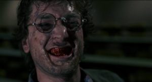 Student reporter Frank (Mitch Watson) is infected by a nasty virus in Vittorio Rambaldi's Primal Rage (1988)