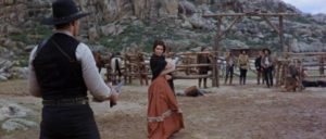 The Widow (Nieves Navarro) steps between Corbett (Lee Van Cleef)and her unruly ranch hands in Sergio Sollima's The Big Gundown (1967)