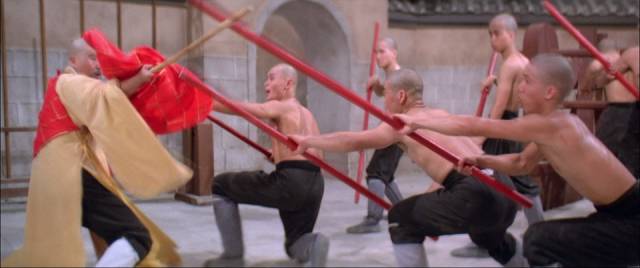 Acolytes practice pole fighting in Lau Kar-leung's The 36th Chamber of Shaolin (1978)