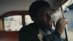 Released from the children's home, Alex Wheatle (Sheyl Cole) is entranced by the street life of Brixton in Steve McQueen's Alex Wheatle (2020)