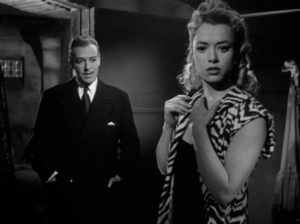 Rita (Olga Zubarry) tries to conceal what she knows from prosecutor Dr. Bernard (Roberto Escalada) in Román Viñoly Barreto’s El vampiro negro (1953)