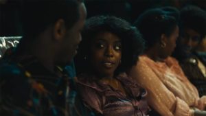 Martha (Amarah-Jae St. Aubyn) and Franklyn (Micheal Ward) are drawn together during the party in Steve McQueen's Lovers Rock (2020)