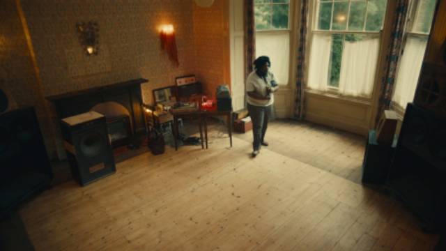 The house is cleared in preparation for a "blues party" in Steve McQueen's Lovers Rock (2020)