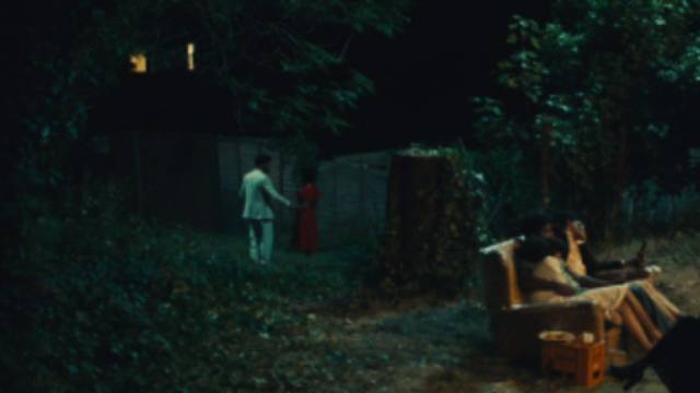 Predatory Bammy (Daniel Francis-Swaby) leads Cynthia (Ellis George) away to attempt rape in Steve McQueen's Lovers Rock (2020)