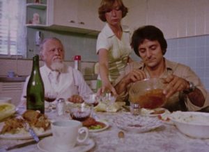 A tense family dinner with Cuda (Lincoln Maazel), his granddaughter Christina (Christine Forrest) and her boyfriend Arthur (Tom Savini) in George A. Romero's Martin (1976)
