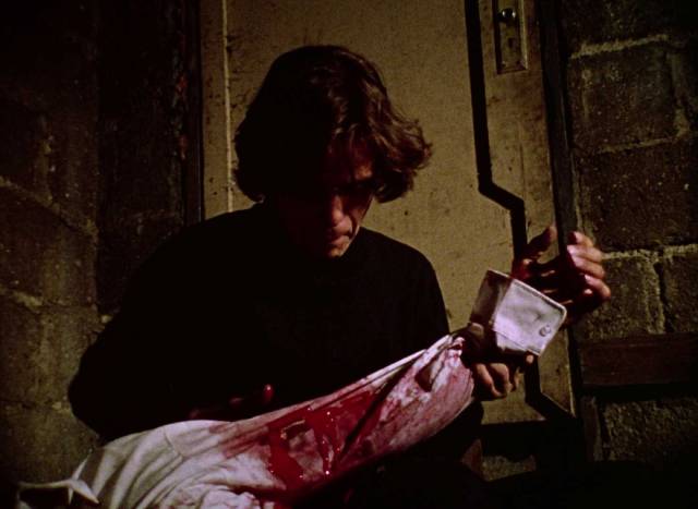 Desperate, Martin (John Amplas) resorts to attacking winos in a derelict building in George A. Romero's Martin (1976)