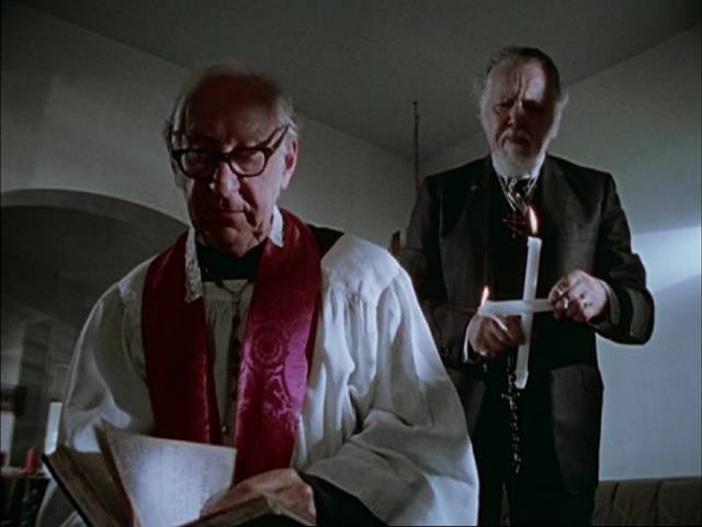Cuda (Lincoln Maazel) asks Father Zulemas (J. Clifford Forrest Jr.) to perform an exorcism in George A. Romero's Martin (1976)