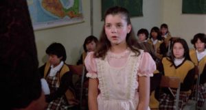 Flavia (Elsa María Gutiérrez) is nervous on her first day at the new school in Carlos Enrique Taboada's Poison for the Fairies (1986)