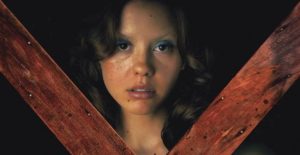 Mia Goth as a porn actress who encounters a rural killer in Ti West's X (2022)