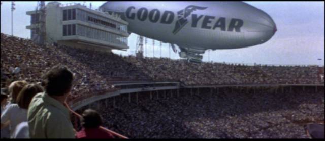 The Super Bowl crowd is taken by surprise as the GoodYear blimp plunges towards the field in John Frankenheimer's Black Sunday (1976)