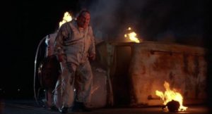 Paul L. Smith as one of the demented exterminators in Sam Raimi's Crimewave (1985)