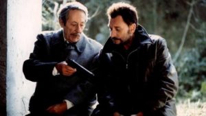 Retired teacher Monesquier (Jean Rochefort) is drawn to Milan (Johnny Hallyday)'s aura of violence in Patrive Leconte's Man on the Train (2002)
