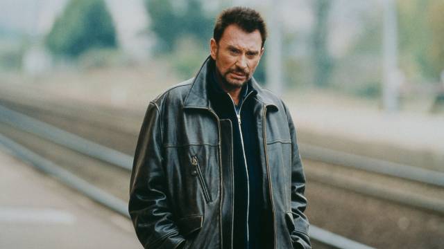 Bank robber Milan (Johnny Hallyday) seems weary of his life choices in Patrice Leconte's Man on the Train (2002)
