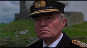 Admiral Brinsden (James Mason) disapproves of ffolkes (Roger Moore)'s unorthodox methods in Andrew V. McLaglen's North Sea Hijack (1980)