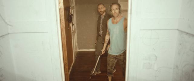 Levi (Justin Benson) and John (Aaron Moorhead) become increasingly uneasy as the phenomena escalate in Justin Benson & Aaron Moorhead's Something in the Dirt (2022)