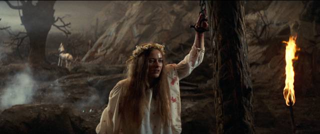 A peasant girl is presented to the dragon as a sacrifice in Matthew Robbins' Dragonslayer (1981)