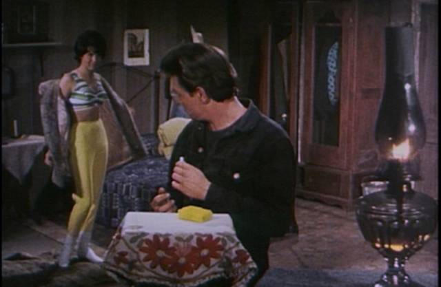 Bad girl Nadine (Rachel Romen) tries to seduce escaped con “Snake” Richards (Earl “Snake” Richards) in Ron Ormond's Girl From Tobacco Row (1966)
