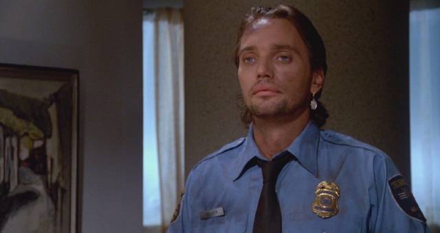 Security guard Volker (Gregory Scott Cummins) isn't here to keep an eye on shoplifters in Richard Friedman's Phantom of the Mall: Eric's Revenge (1989)