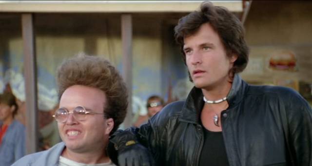 Mechanic Rughead (Clint Howard) brings his maintenance skills to hair-care in Mike Marvin’s The Wraith (1986)