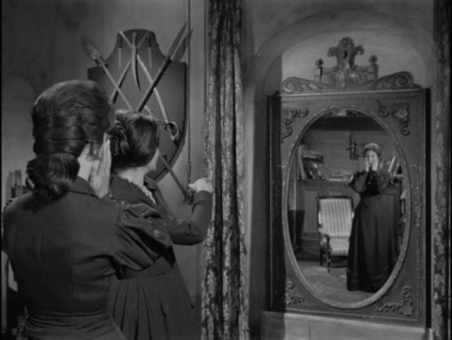 Amelia (Rosita Arenas) discovers something unsettling about her aunt Selma (Rita Macedo) in Rafael Baledón's The Curse of the Crying Woman (1963)