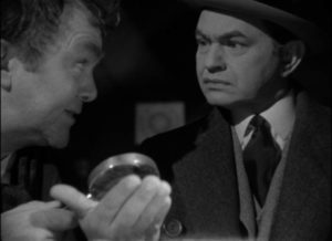 Palm-reader Septimus Podgers (Thomas Mitchell) delivers troubling news to attorney Marshall Tyler (Edward G. Robinson) in Julien Duvivier's Flesh and Fantasy (1943)