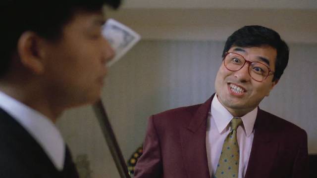 Director Ronny Yu relishes playing villain Ronny Dak in Mang Hoi & Corey Yuen's Lady Reporter (1989)
