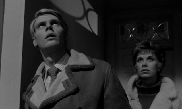 Tony (James Fox) and Susan (Wendy Craig) arrive home unexpectedly and glimpse the secret lives of the underclass in Joseph Losey's The Servant (1963)