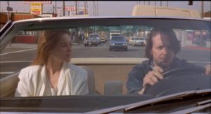 Publisher Tully Sorenson (Alice Krige) wants to save Henry Chinaski (Mickey Rourke) from degradation in Barbet Schroeder's Barfly (1987)