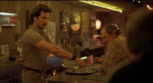 Bartender Eddie (Frank Stallone) gives Henry Chinaski the stink-eye in Barbet Schroeder's Barfly (1987)