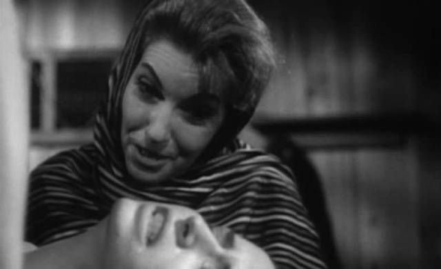Carmen (Velia Martinez) enjoys torturing her captives in William Grefé’s The Devil's Sisters (1966)