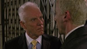 Sleazy businessman Boad (Malcolm McDowell) likes to throw his weight around in Mike Hodges' I'll Sleep When I'm Dead (2002)