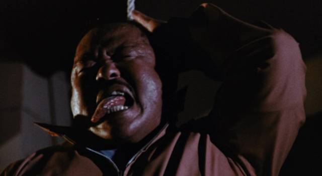 “Karate” Pete (Harold Sakata) struggles against Matt Stone (William Shatner)'s noose in William Grefé’s Impulse (1974)