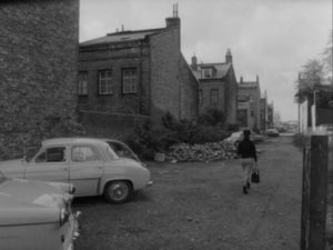 Britt Larsson (Inger Taube) walks home from work in Bo Widerberg's Barnvagnen (The Baby Carriage, 1963)