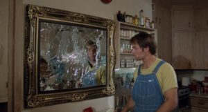Willy (Nicholas Love) shouldn't have pieced the mirror back together in Ulli Lommel's The Boogey Man (1980)
