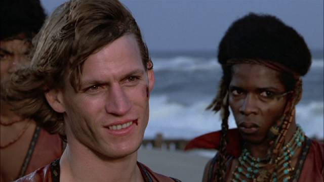Secure on home ground the gang faces Luther's renegade gang on the Coney Island beach at dawn in Walter Hill's The Warriors (1979)