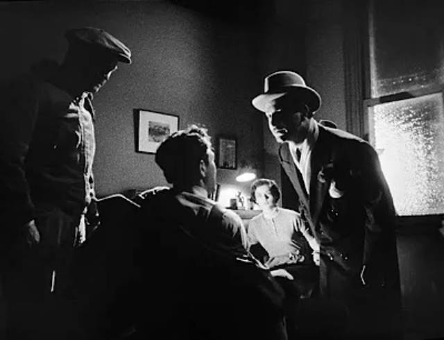 Members of the gang come down hard on Mike Hammer (Biff Elliot) and his secretary Velda (Margaret Sheridan) in Harry Essex's I, the Jury (1953)