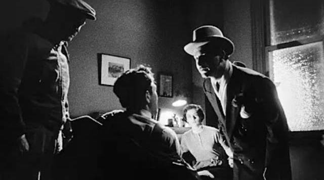 Members of the gang come down hard on Mike Hammer (Biff Elliot) and his secretary Velda (Margaret Sheridan) in Harry Essex's I, the Jury (1953)