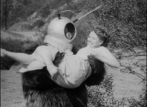 Ro-Man inevitably succumbs to the sexual allure of an Earth-woman in Robot Monster (1953)