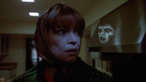 Captain Howdy makes a subliminal appearance over Chris MacNeil (Ellen Burstyn)'s shoulder in William Friedkin's The Exorcist (1971)