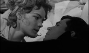 The Advocate's nurse (Romy Schneider) is attracted to the desperate Josef K. (Anthony Perkins) in Orson Welles's The Trial (1962)