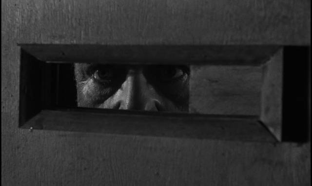 Seeking entry into the Advocate's domain in Orson Welles's The Trial (1962)