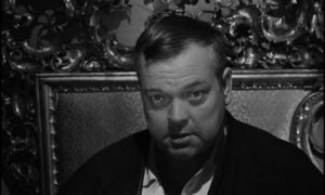 The Advocate (Orson Welles) condescends to his clients in Orson Welles's The Trial (1962)