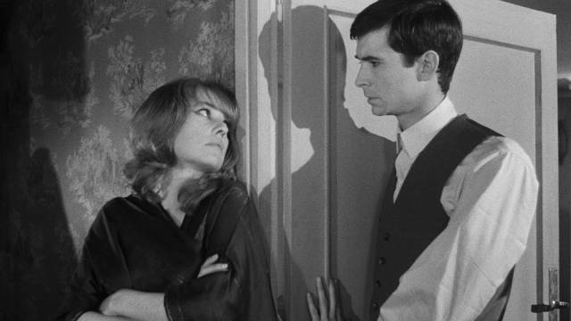 Josef K. (Anthony Perkins) chats with his neighbour Miss Burstner (Jeanne Moreau) in Orson Welles's The Trial (1962)