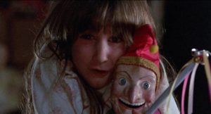 Judy (Carrie Lorraine) befriends a malevolent Mr. Punch in Stuart Gordon's Dolls (1986)