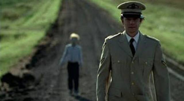 Dad (Tom McCamus) leads the problematic part of Nicholas (Jeff Sutton) away to a place where it can be permanently hidden in Jeff Erbach's The Nature of Nicholas (2002)