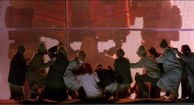 Spectators panic as a giant combat robot collapses on the stands in Stuart Gordon's Robot Jox (1989)
