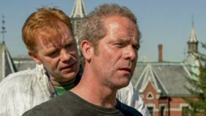 Phil (David Caruso) knows something's wrong with his boss Gordon Fleming (Peter Mullan) in Brad Anderson's Session 9 (2001)