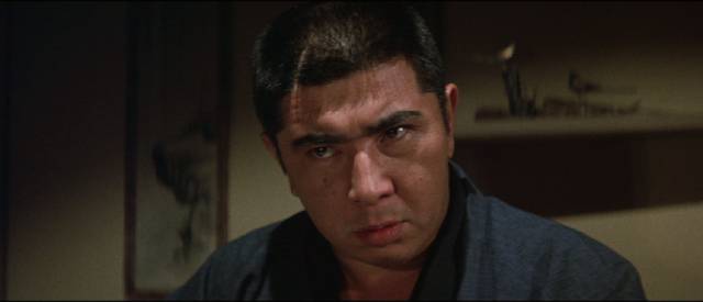 Tetsuo Matsuda (Tomisaburô Wakayama) doesn't like the way the crime family is being run in Kôsaku Yamashita's Big Time Crime Boss (1968)